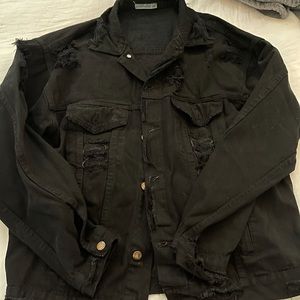 Distressed Denim jacket with skull decal on back